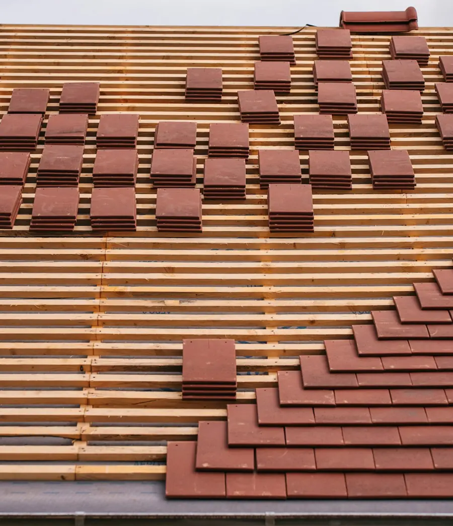 Roof replacement in Atlanta GA with new roofing materials laid out on decking