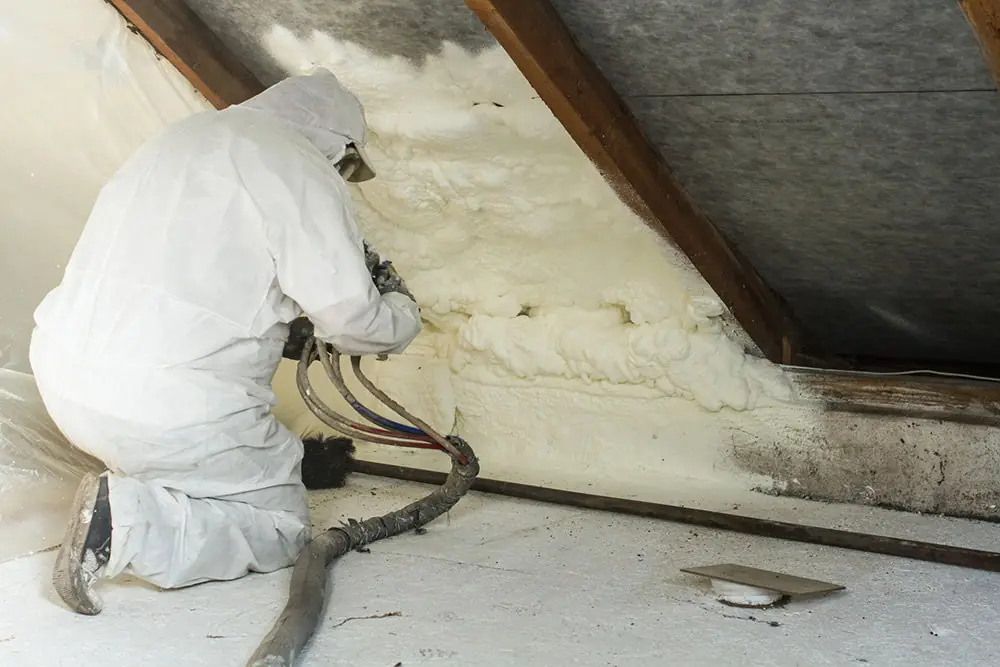 Spray foam insulation in Atlanta GA being applied under a roof deck